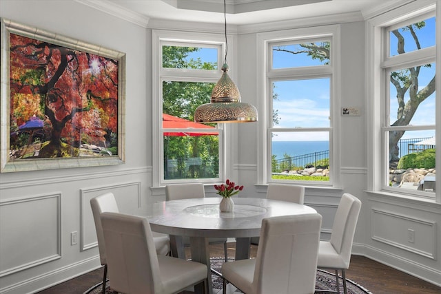 321 Sandpiper Dr, Riverhead, NY 11901 - dining area with a decorative wall, ornamental molding, dark wood-style flooring, and a water view