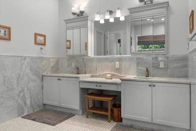 321 Sandpiper Dr, Riverhead, NY 11901 - full bathroom featuring tile walls, vanity, and a wainscoted wall