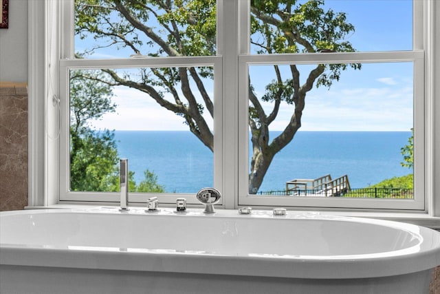 321 Sandpiper Dr, Riverhead, NY 11901 - full bathroom with a water view and a freestanding tub