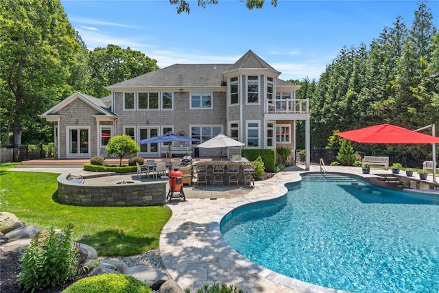 321 Sandpiper Dr, Riverhead, NY 11901 - swimming pool with a patio and an outdoor fire pit