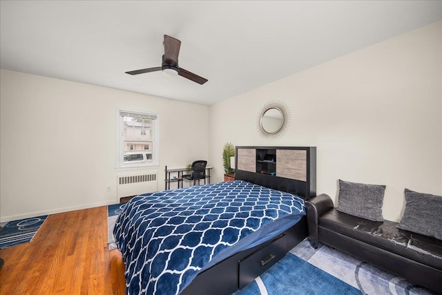 769 De Mott Ave, North Baldwin, NY 11510 - bedroom featuring radiator, wood finished floors, baseboards, and ceiling fan