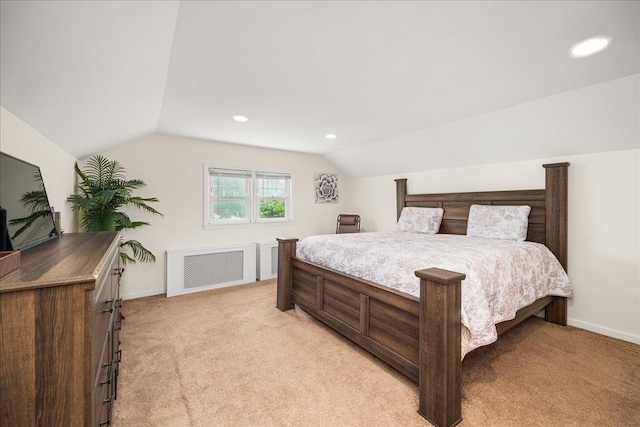 769 De Mott Ave, North Baldwin, NY 11510 - bedroom with radiator, vaulted ceiling, light carpet, baseboards, and recessed lighting