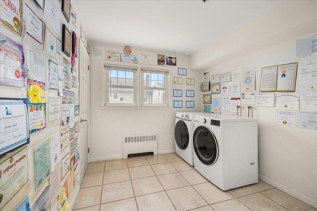 769 De Mott Ave, North Baldwin, NY 11510 - laundry room with radiator heating unit, washing machine and dryer, light tile patterned flooring, and baseboards