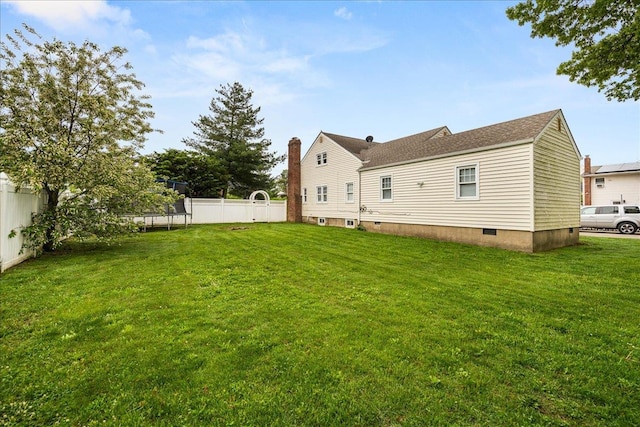 769 De Mott Ave, North Baldwin, NY 11510 - back of house featuring a trampoline and crawl space