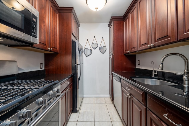 100 Lincoln Ave Unit 4B, Mineola, NY 11501 - kitchen with stainless steel appliances, a sink, dark stone counters, and light tile patterned flooring