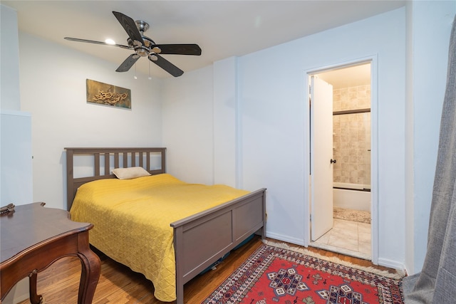 100 Lincoln Ave Unit 4B, Mineola, NY 11501 - bedroom featuring wood finished floors, ensuite bath, and ceiling fan