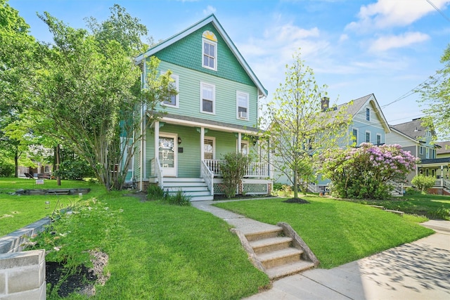 213 Walnut St, Peekskill, NY 10566 - victorian-style house featuring a porch and a front lawn