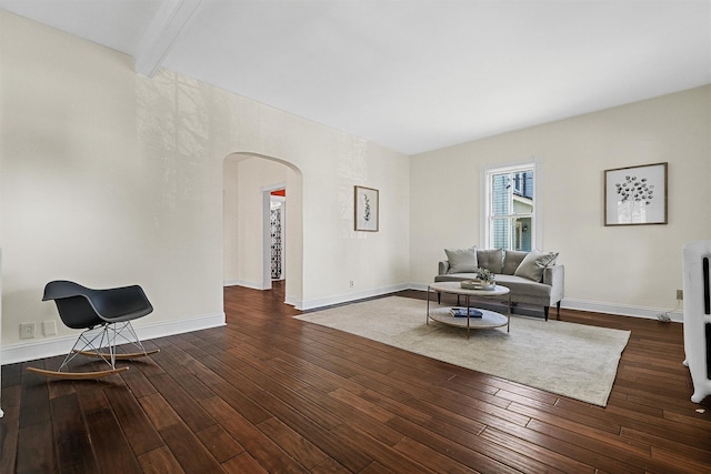 213 Walnut St, Peekskill, NY 10566 - living room with arched walkways, wood-type flooring, baseboards, and beamed ceiling