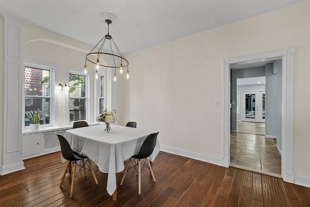 213 Walnut St, Peekskill, NY 10566 - dining area featuring baseboards, dark wood-type flooring, and a chandelier
