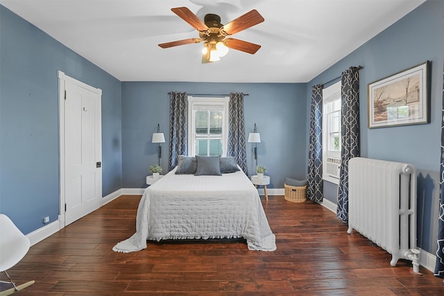 213 Walnut St, Peekskill, NY 10566 - bedroom with radiator heating unit, baseboards, wood finished floors, and a ceiling fan
