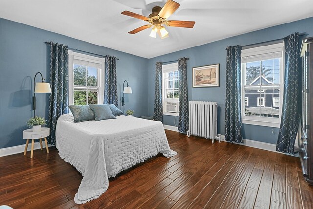 213 Walnut St, Peekskill, NY 10566 - bedroom featuring radiator heating unit, baseboards, hardwood / wood-style flooring, and ceiling fan