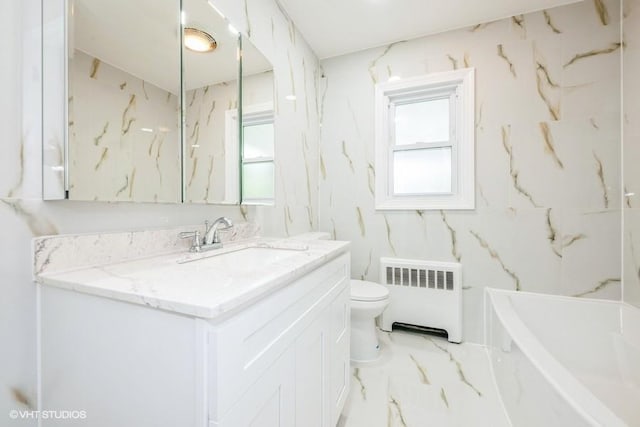 2600 Haff Ave, North Bellmore, NY 11710 - full bathroom with radiator, toilet, vanity, a tub to relax in, and marble finish floors