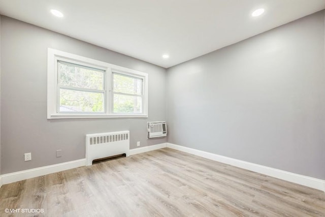 2600 Haff Ave, North Bellmore, NY 11710 - unfurnished room with radiator heating unit, wood finished floors, baseboards, and recessed lighting
