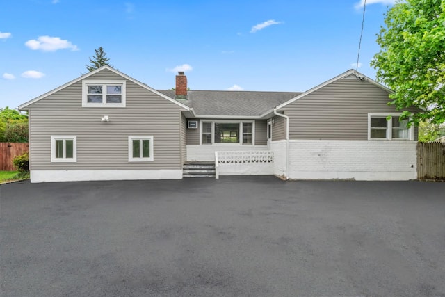 2600 Haff Ave, North Bellmore, NY 11710 - back of property with a chimney and brick siding
