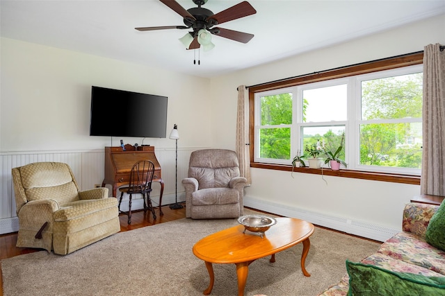 186 Oswego Rd, Pleasant Valley, NY 12569 - living room featuring a baseboard radiator, wood finished floors, and a ceiling fan