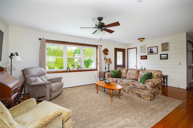 186 Oswego Rd, Pleasant Valley, NY 12569 - living room with plenty of natural light, dark wood-style flooring, a ceiling fan, and baseboards