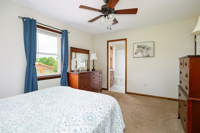 186 Oswego Rd, Pleasant Valley, NY 12569 - bedroom with carpet, baseboards, a ceiling fan, and connected bathroom
