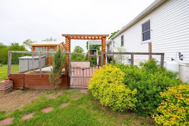 186 Oswego Rd, Pleasant Valley, NY 12569 - view of yard featuring a vegetable garden and a pergola