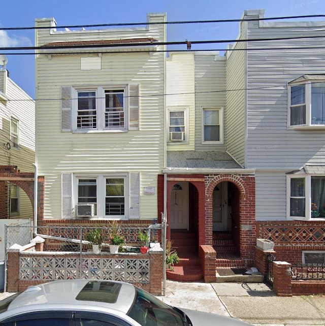 10919 127th St, South Ozone Park, NY 11420 - townhome / multi-family property featuring brick siding and cooling unit