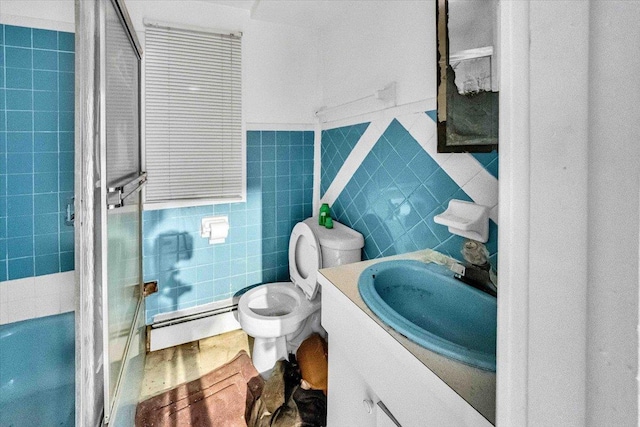 3038 Tiemann Ave, Bronx, NY 10469 - full bathroom featuring a baseboard heating unit, vanity, toilet, tile walls, and shower / tub combination