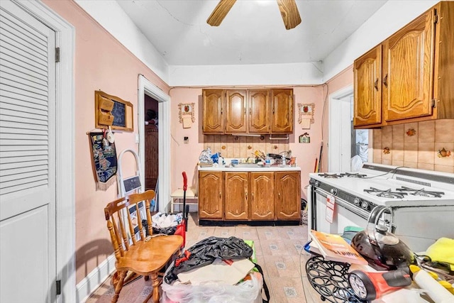 3038 Tiemann Ave, Bronx, NY 10469 - kitchen featuring brown cabinets, light countertops, and decorative backsplash