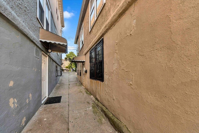 3038 Tiemann Ave, Bronx, NY 10469 - view of property exterior with stucco siding