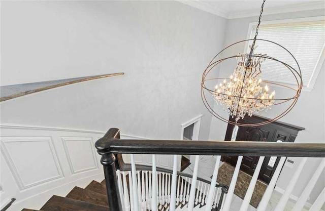 10 Colonial Dr, Smithtown, NY 11787 - stairs featuring a chandelier and ornamental molding