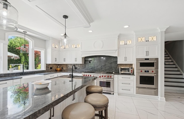 10 Colonial Dr, Smithtown, NY 11787 - kitchen featuring appliances with stainless steel finishes, a warming drawer, a sink, light marble finish flooring, and recessed lighting