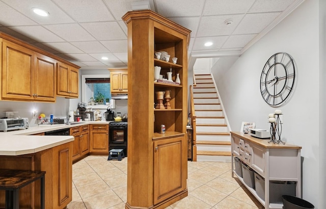 10 Colonial Dr, Smithtown, NY 11787 - kitchen with a paneled ceiling, black range with electric stovetop, light countertops, recessed lighting, and light tile patterned floors