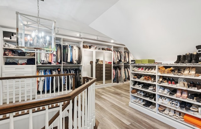 10 Colonial Dr, Smithtown, NY 11787 - spacious closet with wood finished floors and a chandelier