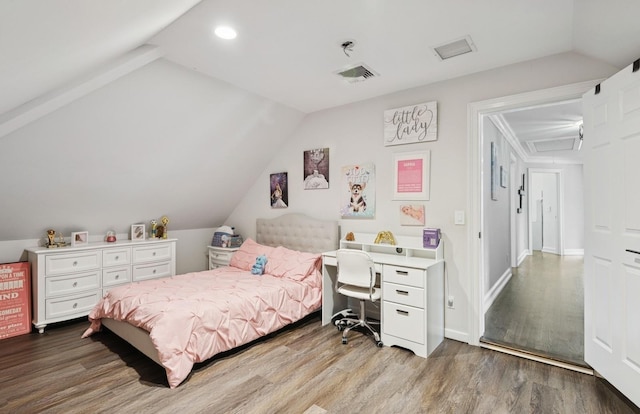 10 Colonial Dr, Smithtown, NY 11787 - bedroom with vaulted ceiling, wood finished floors, recessed lighting, and baseboards