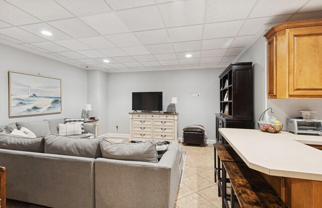 10 Colonial Dr, Smithtown, NY 11787 - living room featuring light tile patterned floors, recessed lighting, a paneled ceiling, and baseboards