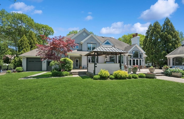 10 Colonial Dr, Smithtown, NY 11787 - view of front facade featuring a gazebo, a front lawn, and a chimney