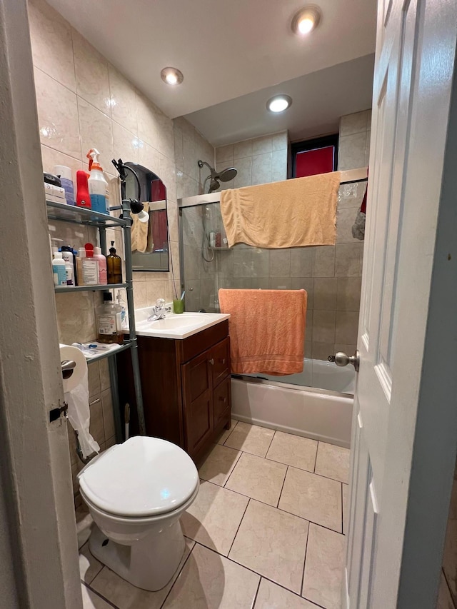 3239 Barker Ave Unit L J, Bronx, NY 10467 - bathroom featuring tile walls, vanity, tile patterned floors,  shower combination, and toilet