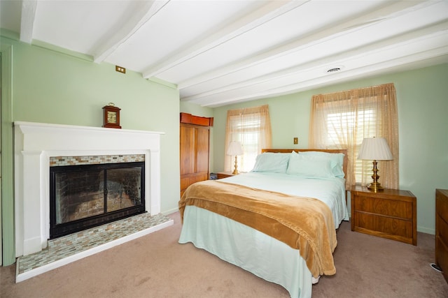 20 Division St, Cold Spring, NY 10516 - carpeted bedroom with beamed ceiling, a tile fireplace, and baseboards