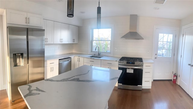 40 Frederick, Call Listing Agent, NJ 07643 - kitchen with appliances with stainless steel finishes, wall chimney range hood, a sink, decorative backsplash, and light stone countertops