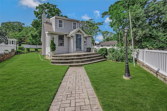 115 Dawn Rd, Rocky Point, NY 11778 - view of front of home with a fenced backyard and a chimney