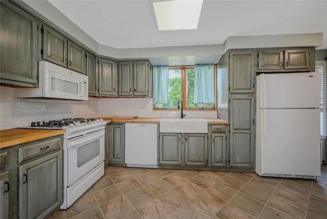 115 Dawn Rd, Rocky Point, NY 11778 - kitchen with white appliances, backsplash, and wooden counters