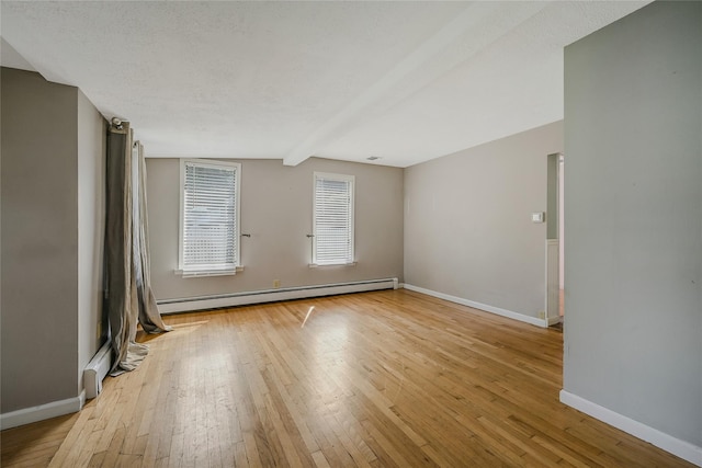 115 Dawn Rd, Rocky Point, NY 11778 - unfurnished room featuring a baseboard heating unit and wood-type flooring