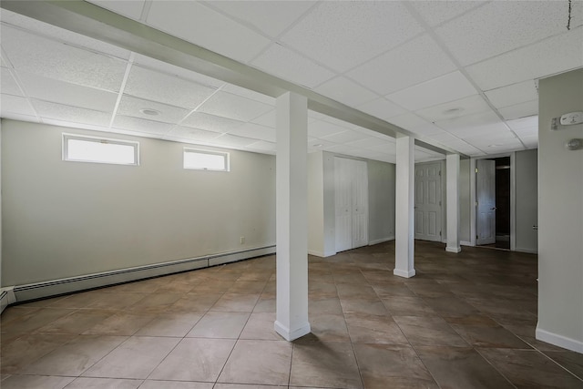 115 Dawn Rd, Rocky Point, NY 11778 - below grade area with a baseboard radiator and a drop ceiling