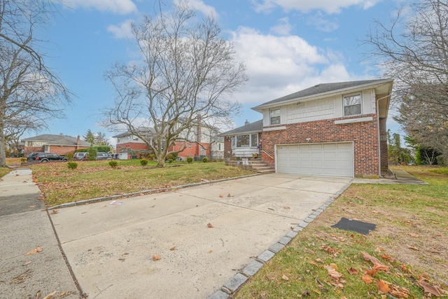 216 Birch Dr, New Hyde Park, NY 11040 - view of front facade with a garage, driveway, brick siding, and a front lawn