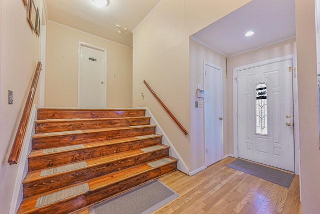 216 Birch Dr, New Hyde Park, NY 11040 - entryway featuring crown molding, light wood-type flooring, stairs, baseboards, and recessed lighting