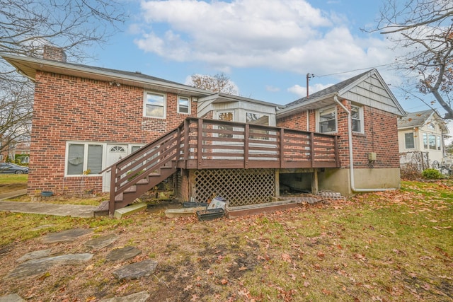 216 Birch Dr, New Hyde Park, NY 11040 - back of house with a chimney, brick siding, a deck, and stairway
