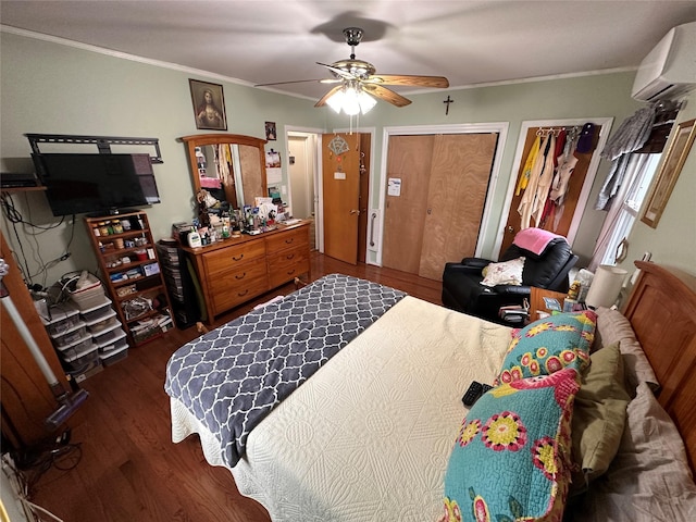 65 Stephen Pl, Valley Stream, NY 11580 - bedroom featuring an AC wall unit, wood finished floors, ornamental molding, a ceiling fan, and multiple closets