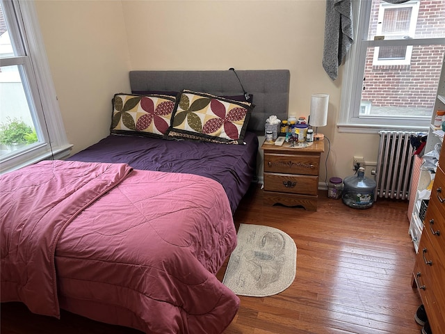 65 Stephen Pl, Valley Stream, NY 11580 - bedroom with radiator and wood finished floors