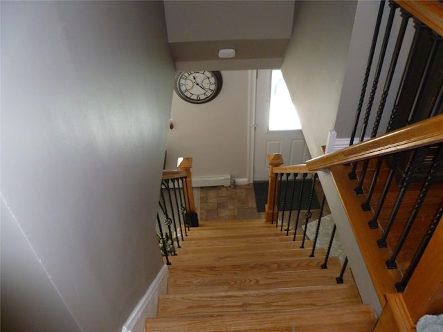 28 Crabtree Ln, Levittown, NY 11756 - stairway with baseboards and wood finished floors