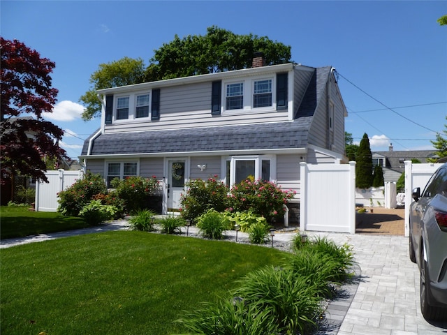28 Crabtree Ln, Levittown, NY 11756 - view of front of home with a chimney, a gate, and a shingled roof