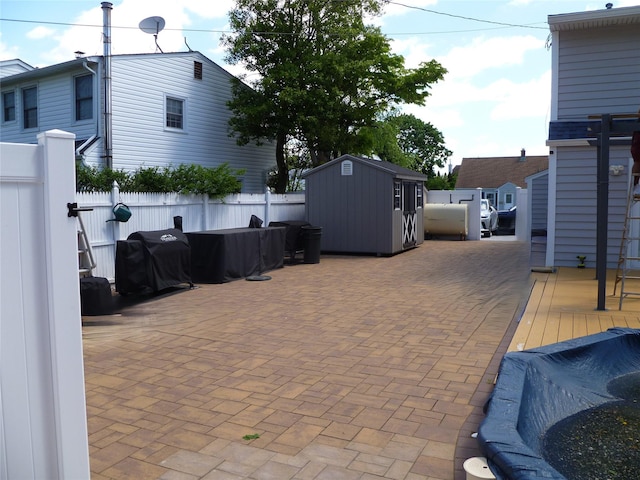 28 Crabtree Ln, Levittown, NY 11756 - fenced backyard with area for grilling and a patio area