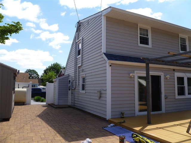 28 Crabtree Ln, Levittown, NY 11756 - view of home's exterior with a patio and a pergola