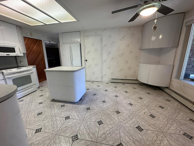 61 John St, Port Jefferson Station, NY 11776 - kitchen with white appliances, ceiling fan, a baseboard radiator, and a center island
